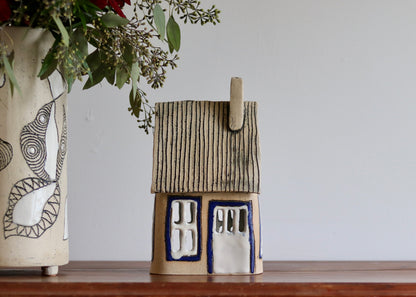 Lantern House - Tan with blue windows