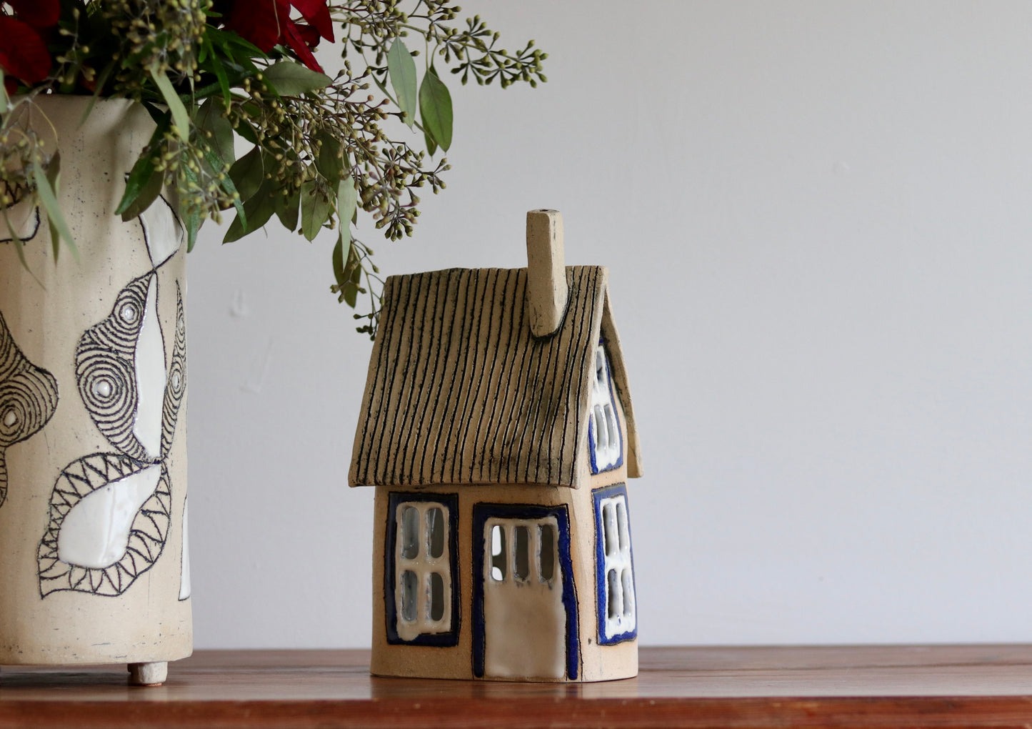 Lantern House - Tan with blue windows