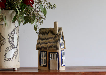 Lantern House - Tan with blue windows