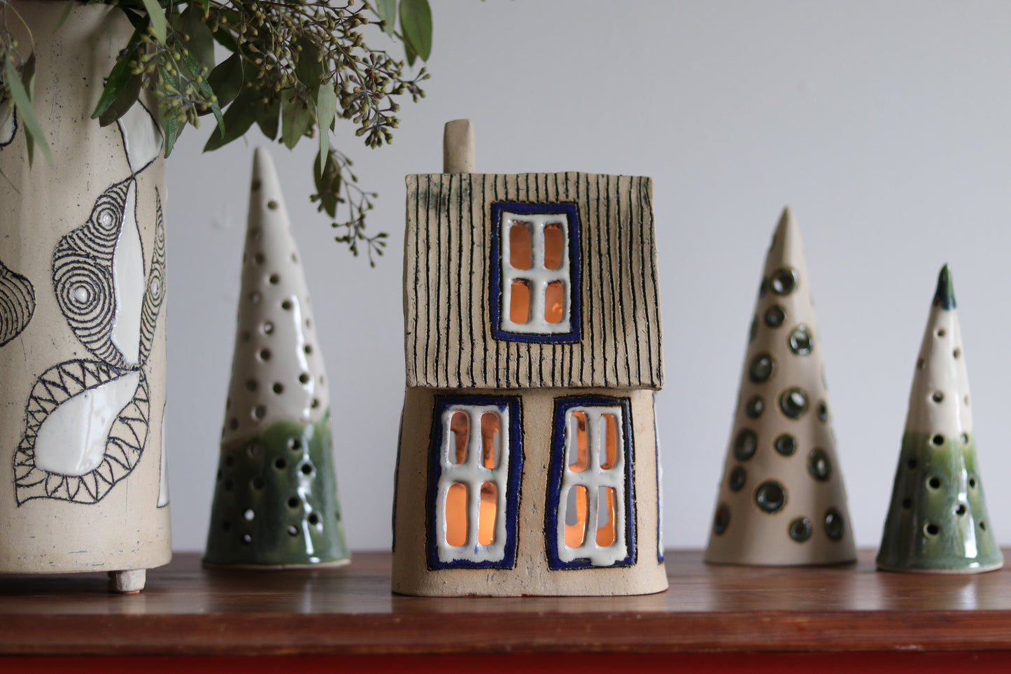 Lantern House - Tan with blue windows